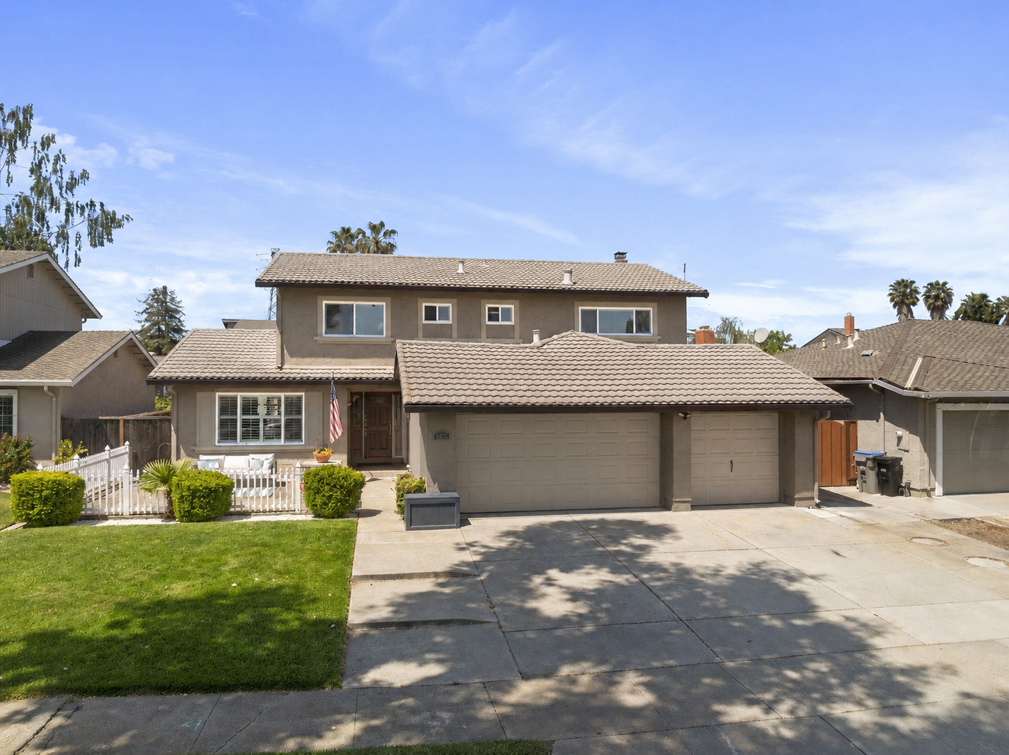 Taupe exterior paint mockup with cream and bronze trim
